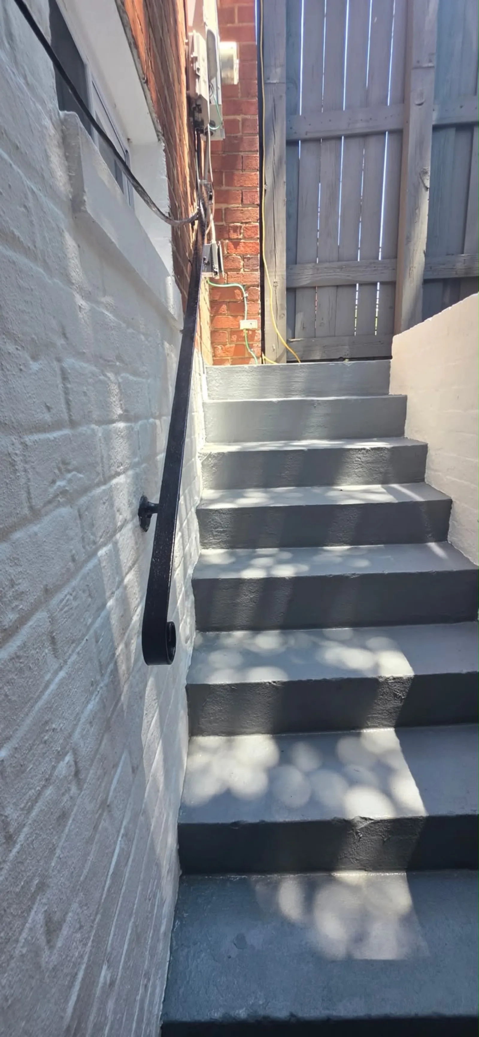 Basement stairs repaired and painted