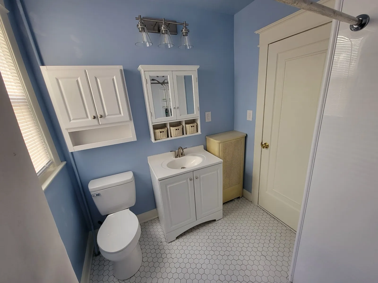 Remodeled bathroom in Maryland with a new vanity light bar
