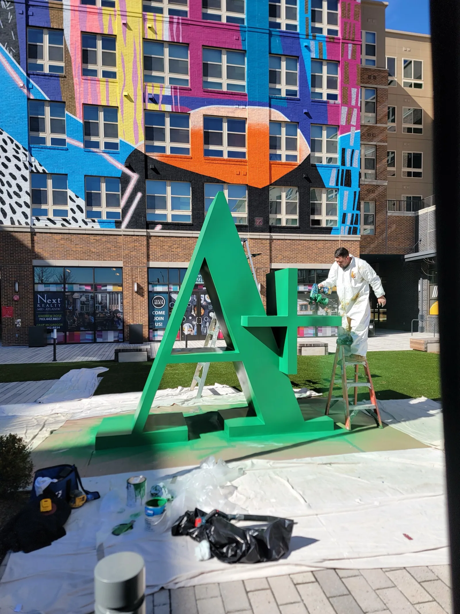 Commercial sign painting at an apartment building by Handyman At Your Command