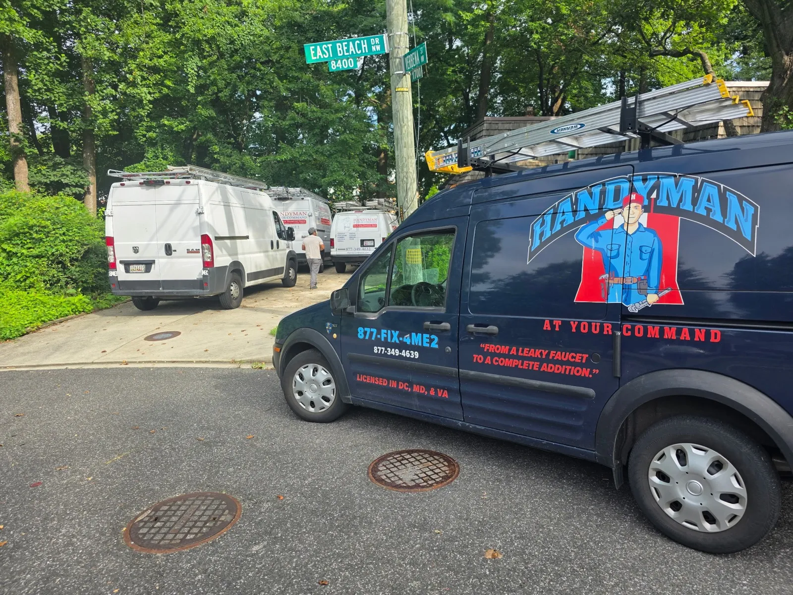 Handyman At Your Command service vans lined up for the day's jobs