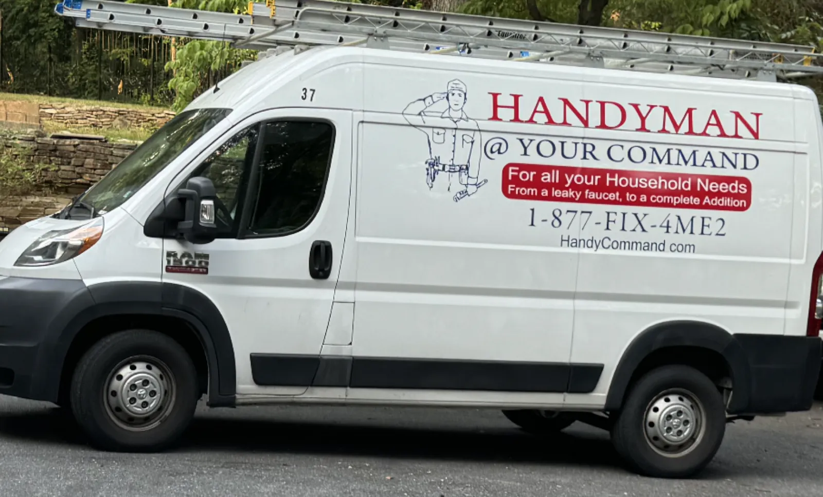 Handyman At Your Command service van on a job