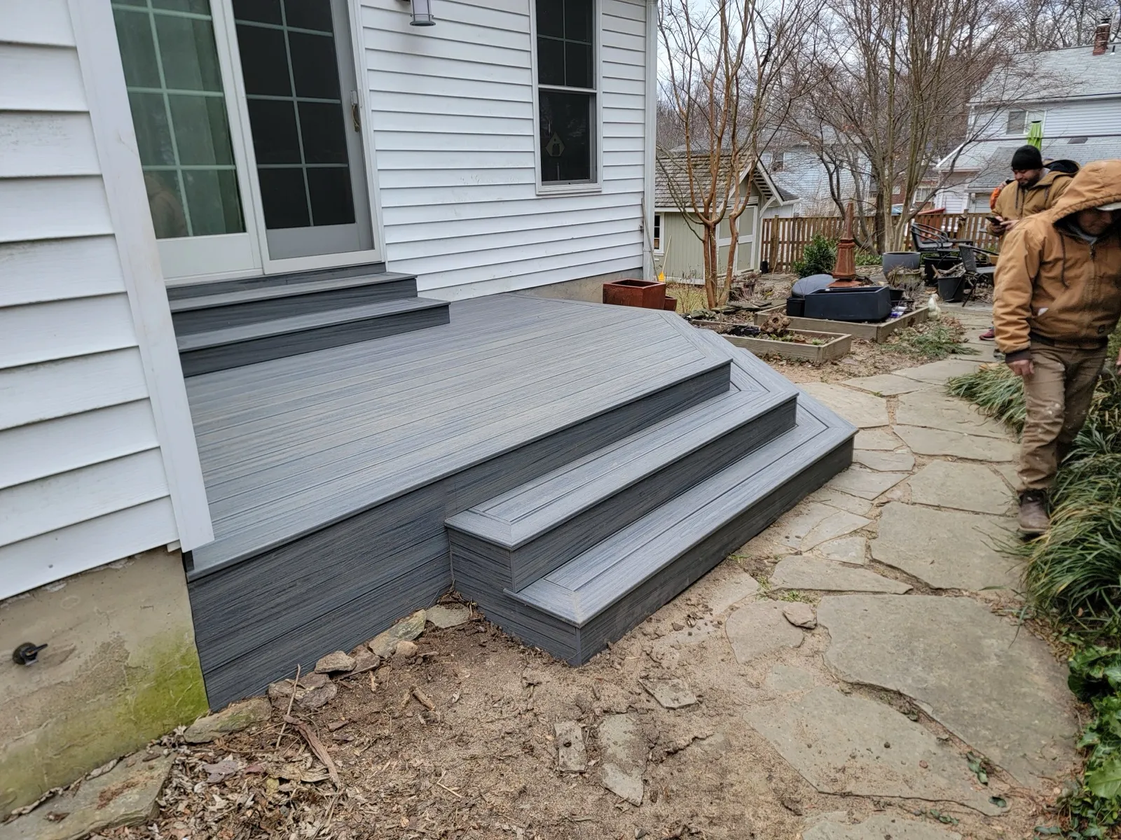 Composite deck and stone walkway built by Handyman At Your Command in Odenton MD