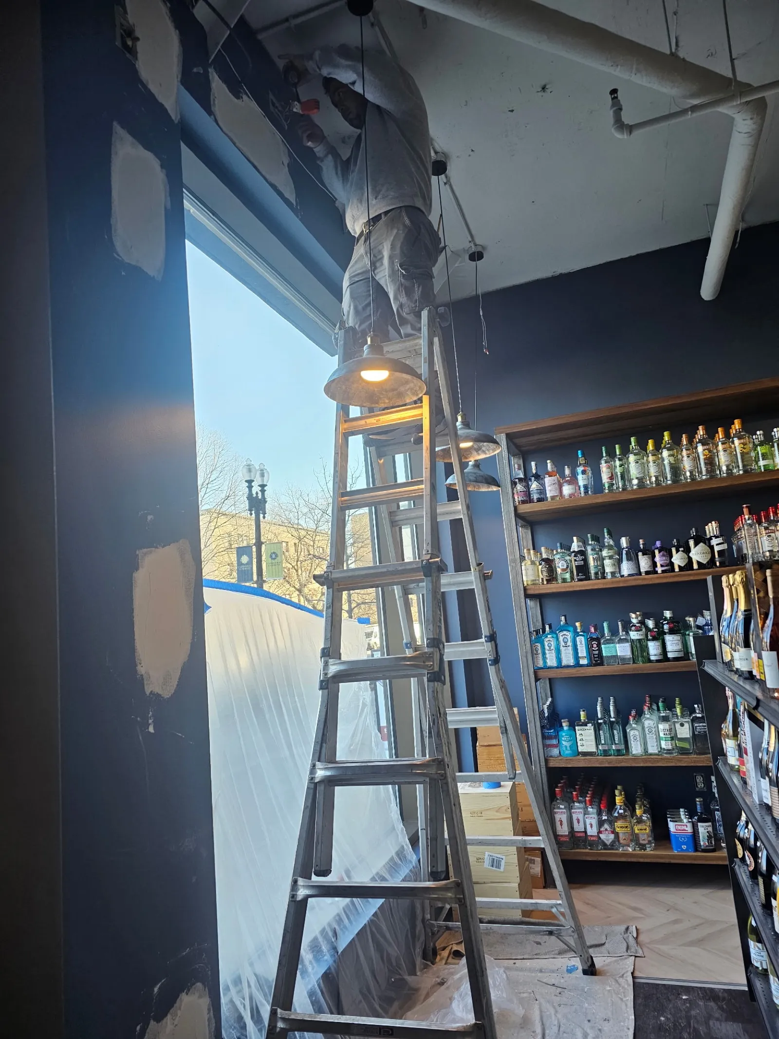 Interior painting on a commercial wall by Handyman At Your Command