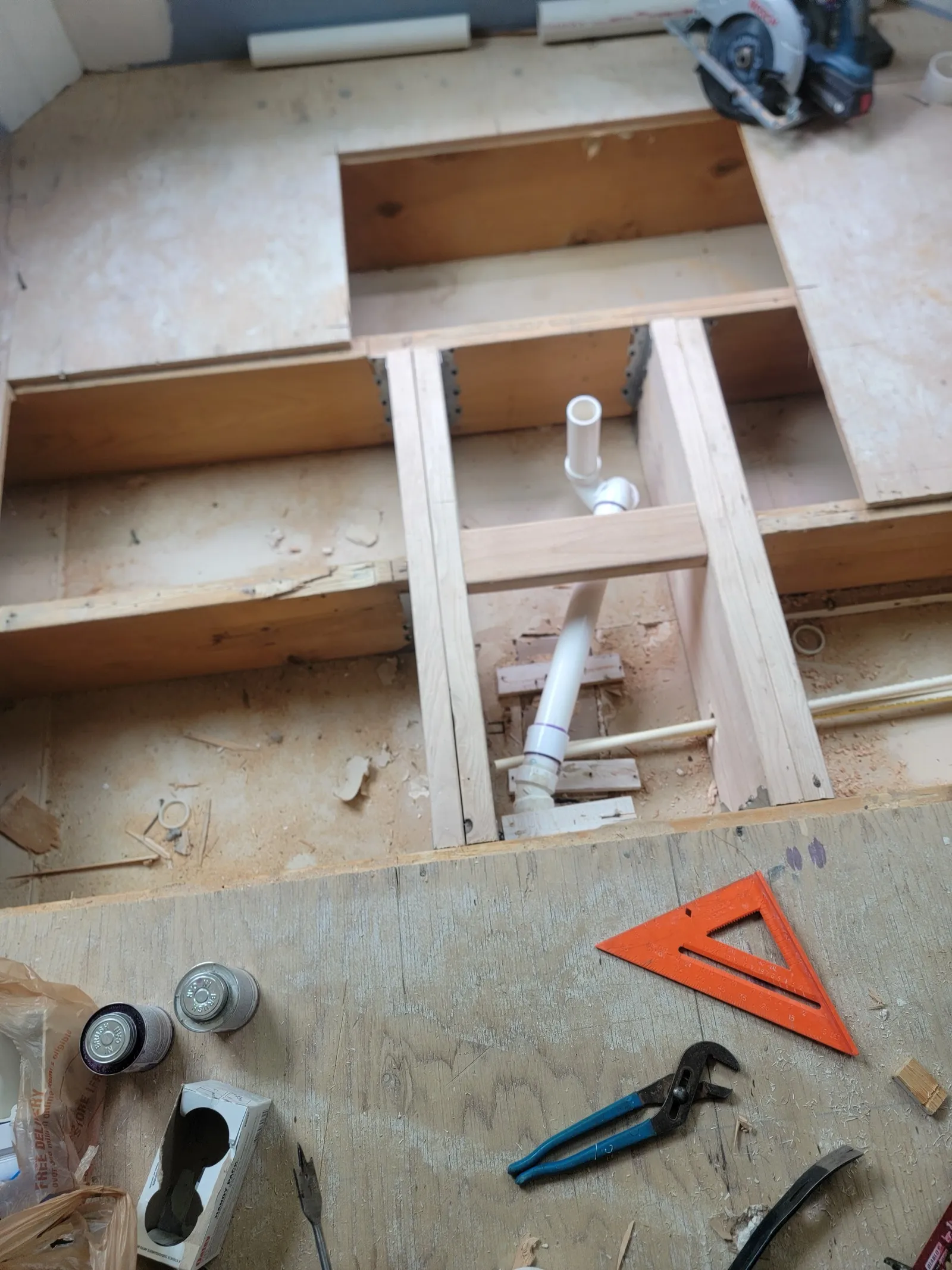 Supply line and drain plumbing repair under a subfloor