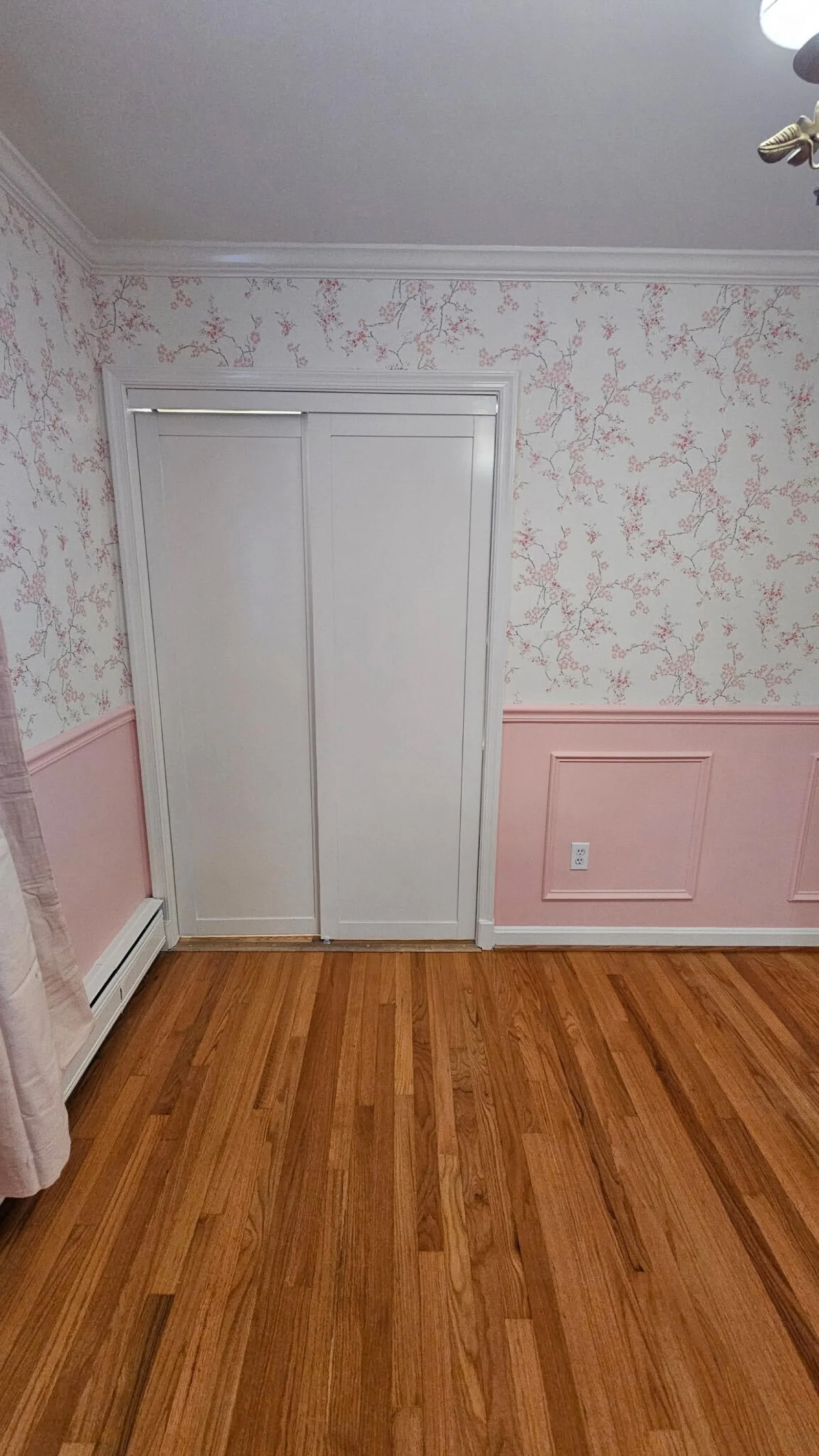 Wallpaper and two tone paint in a refreshed bedroom
